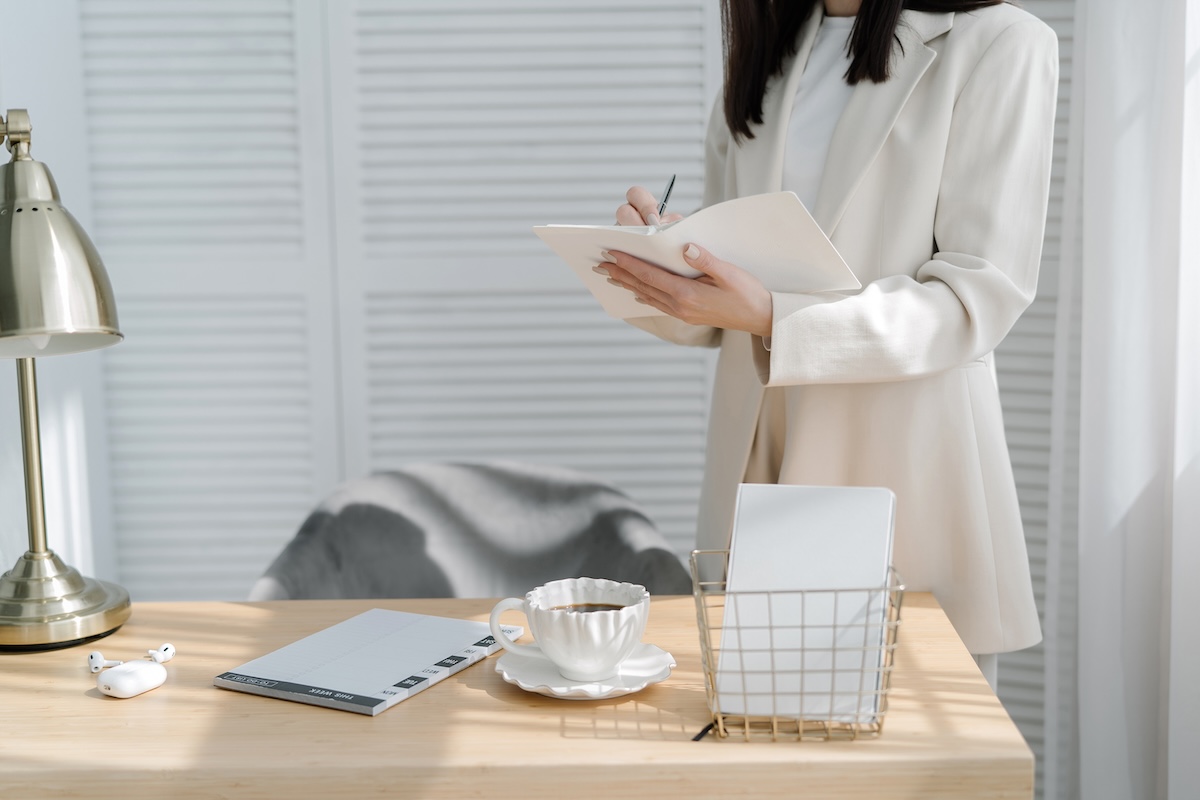 woman in white suit planning for small business growth