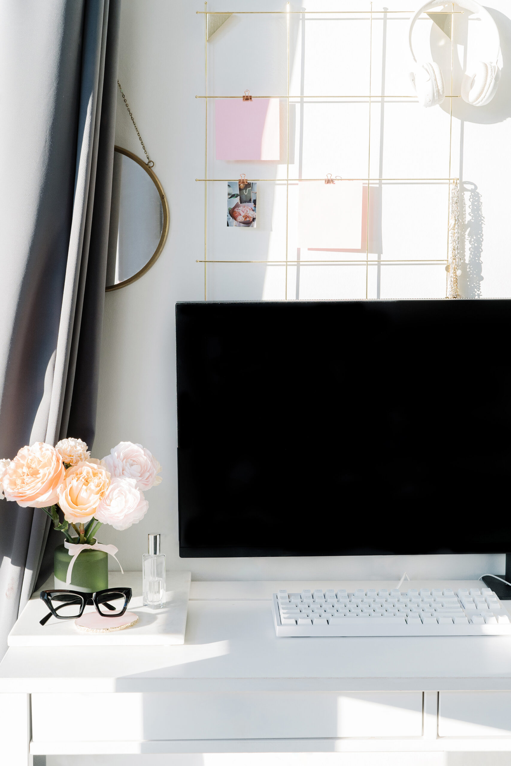 computer on a modern desktop with peach flowers
